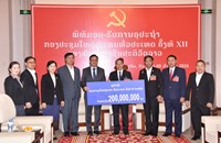 ສອງພາກສ່ວນມອບ-ຮັບ ເງິນຊຸກຍູ້ກອງປະຊຸມໃຫຍ່ ຄັ້ງທີ XII ຂອງພັກ