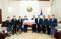 ມອບ-ຮັບເງິນ ຊຸກຍູ້ກອງປະຊຸມໃຫຍ່ຜູ້ແທນທົ່ວປະເທດ ຄັ້ງທີ XII ຂອງພັກປະຊາຊົນ ປະຕິວັດລາວ