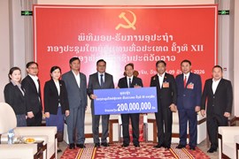 ສອງພາກສ່ວນມອບ-ຮັບ ເງິນຊຸກຍູ້ກອງປະຊຸມໃຫຍ່ ຄັ້ງທີ XII ຂອງພັກ